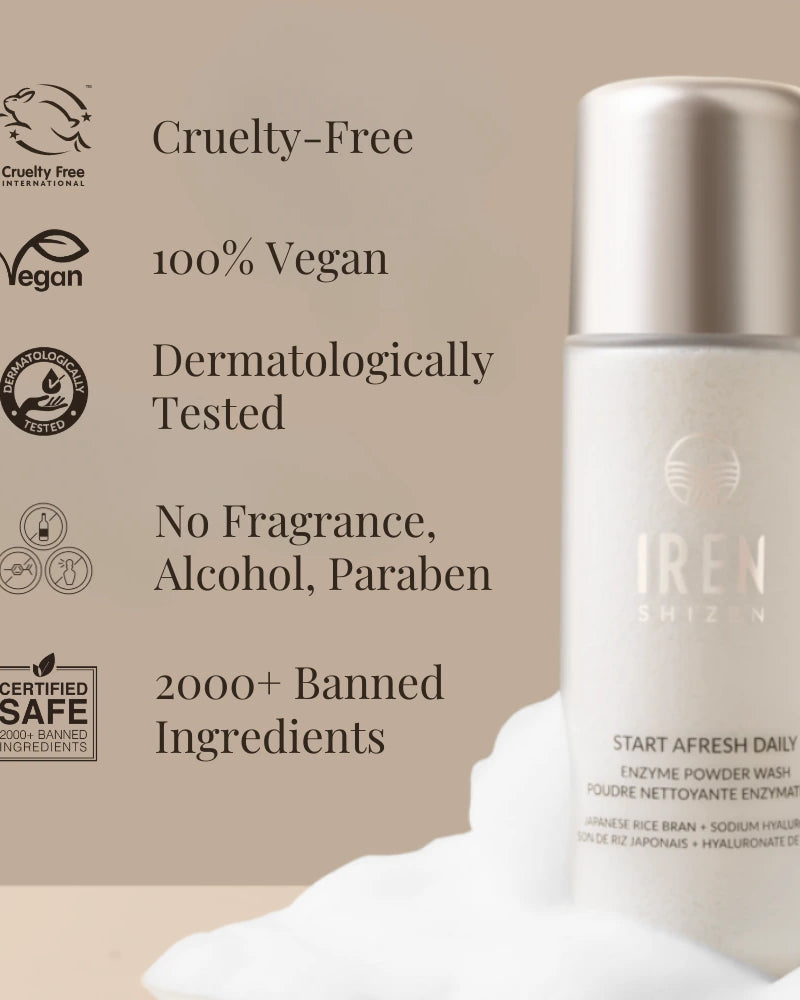 A bottle of IRÉN Shizen START AFRESH DAILY Enzyme Powder Wash on a beige background, with text noting its cruelty-free, vegan, dermatologically tested, and safe ingredients. This gentle daily exfoliant doubles as a rice enzyme cleanser.