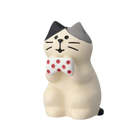 The FREE GIFT Biyu Neko Blind Box by IREN Shizen features a collectible cat figurine with a gray and black head, holding a white item with red dots—an ideal choice for cat figure enthusiasts.