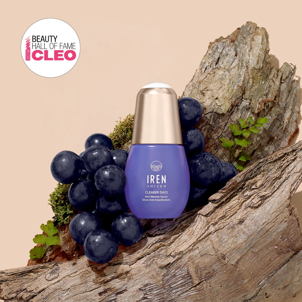 A bottle of IREN Shizen CLEARER DAYS Anti-Blemish Serum sits on a tree trunk with grapes and ferns, featuring a "Beauty Hall of Fame CLEO" award badge in the top left corner.
#all-groups
