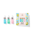 A Japanese skincare discovery kit featuring DEW UP Hydrating serum and a customized fruit bottle from IREN Shizen.