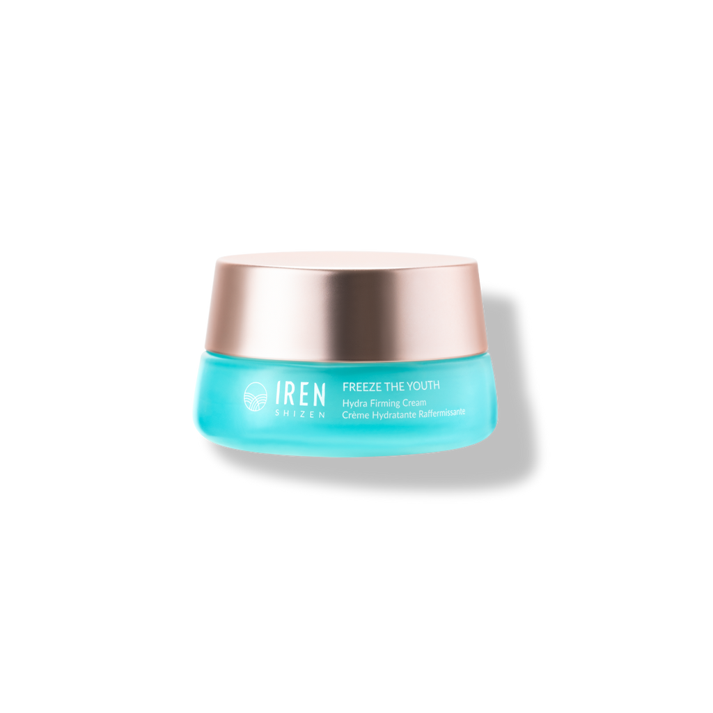 A jar of IREN Shizen "FREEZE THE YOUTH" hydra firming cream with vegan-collagen complex against a black background.