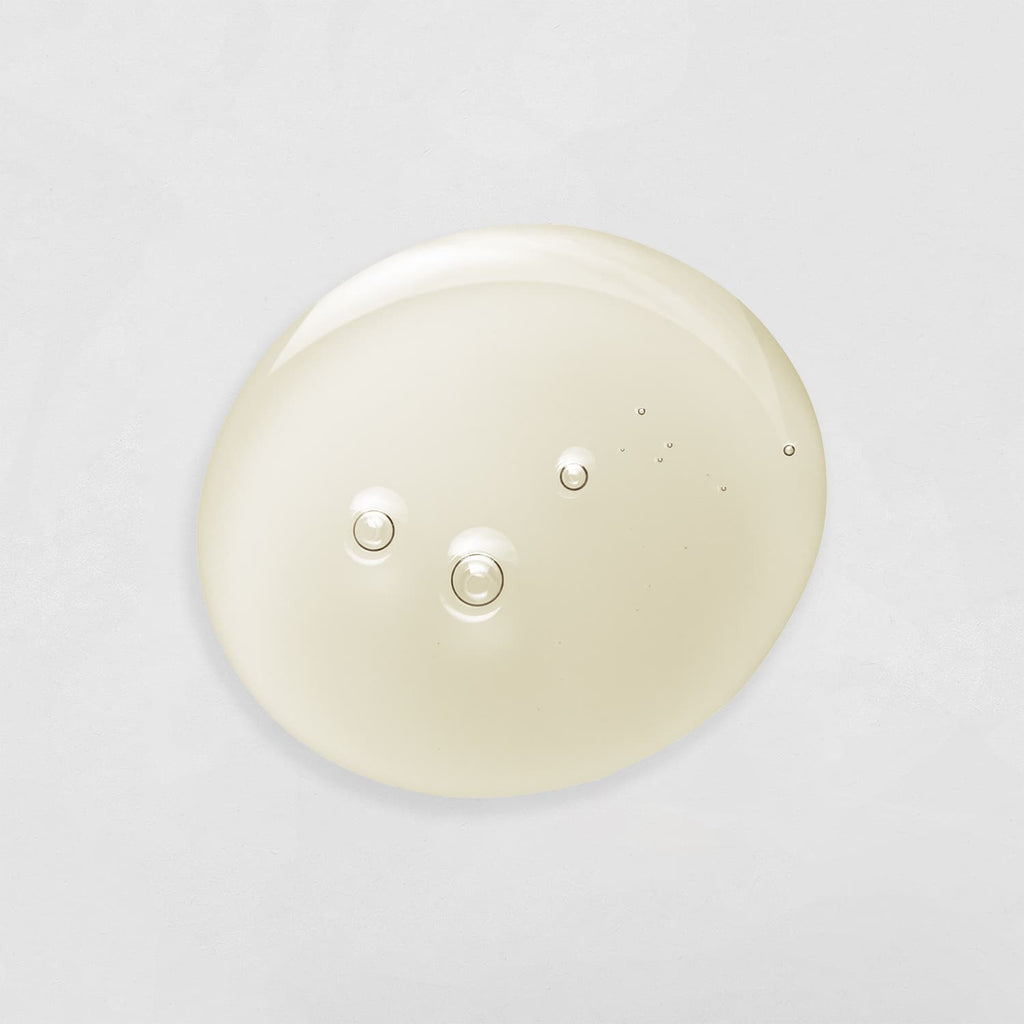 A white DROP OF DEW Moisturizing Facial Oil circle on a white background from the brand IREN Shizen, known for its customised Japanese skincare products.