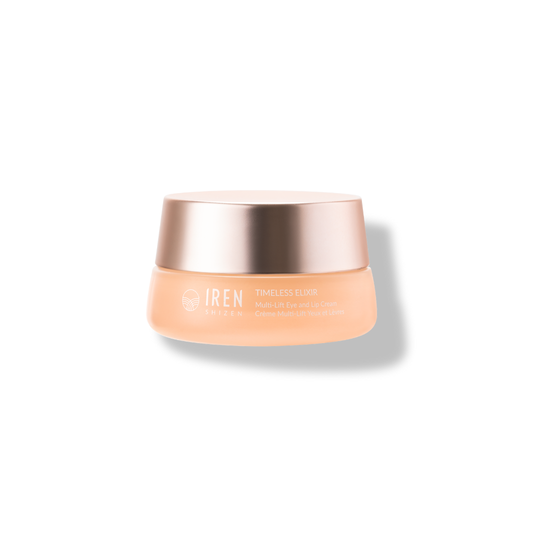 A jar of IREN Shizen SAMPLE Eye & Lip Cream, featuring a golden lid and peach-colored container against a black background.