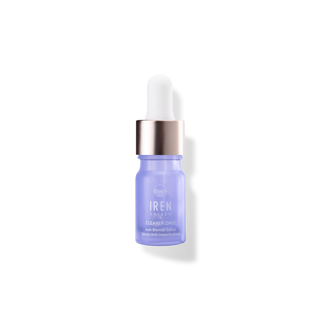 A bottle of IREN Shizen CLEARER DAYS Anti-Blemish Serum on a black background.